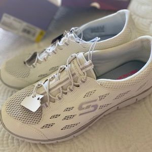 Brand new with tags! White skecher slip ons